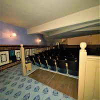 Two spaces for wheelchair users at the back of the stalls