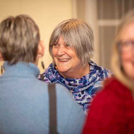 Female volunteers mingling at awards event