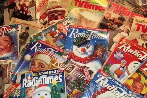 A pile of old Christmas Radio Times editions.