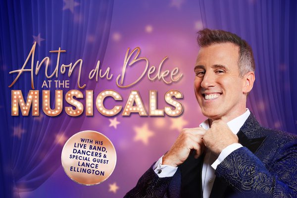 Anton fixes his bow tie standing in front of a purple background next to the show title