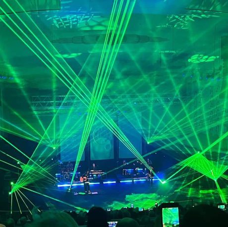 Green strobe lighting covering a stage
