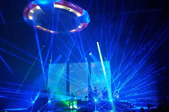 Blue strobe lights covering a stage