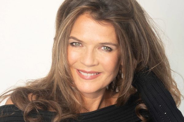 Annabel croft in a black jumper, in front of a white background.