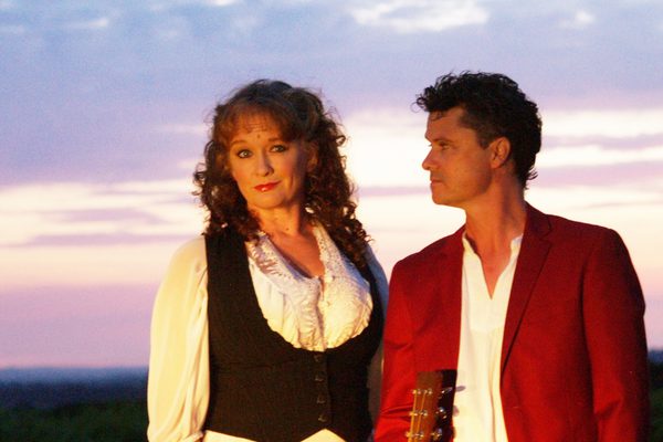 Kathryn Roberts and Sean Lakeman standing in front of a sunset.