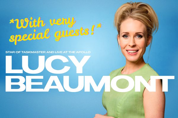 Lucy Beaumont wearing a green dress on a blue background.