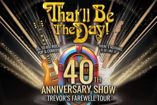 A multicoloured jukebox with two electric guitars next to it.