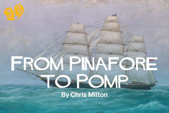 A ship on the ocean. The ocean is vibrant blue, and the ship has many large sails.