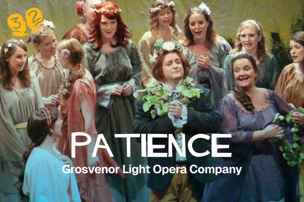 A group of people dressed in bright colours. They all have flowers in their hair.