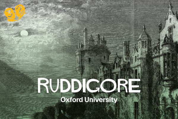 A castle with a dark sky. The moon is peeking through the clouds.