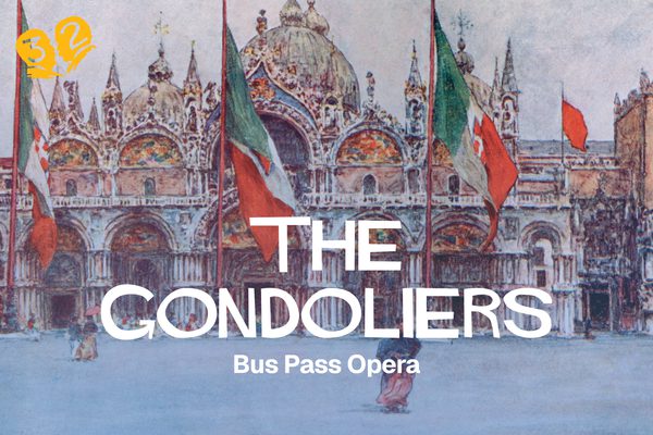 An ornate palace with flags outside it.