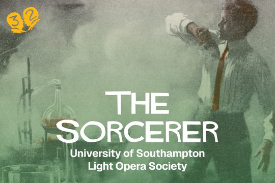 A man in a shirt and tie standing in front of a potion in a laboratory.