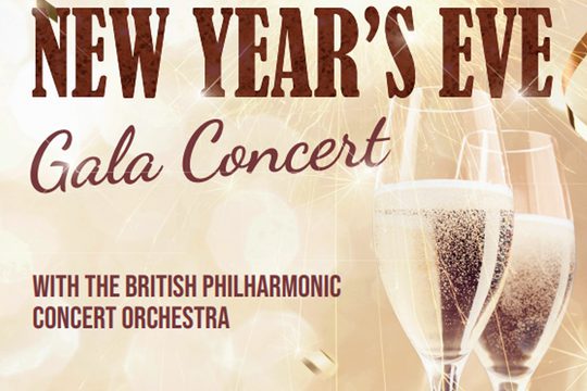Two glasses of champagne on a gold sparkly background. Text: New Year's Eve Gala Concert.