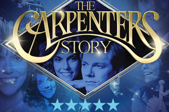 A man and a woman with a blue hue over them, inside a golden diamond.