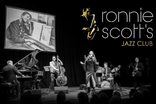 black and white image of a jazz band on a stage.