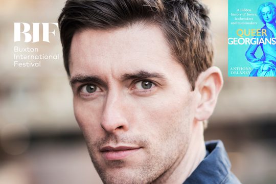 White man with brown hair and brown eyes looks to the camera.
