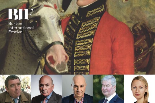 Six people, four men in shirts and ties and a woman with long, blonde hair against a painting of a white horse and soldier.