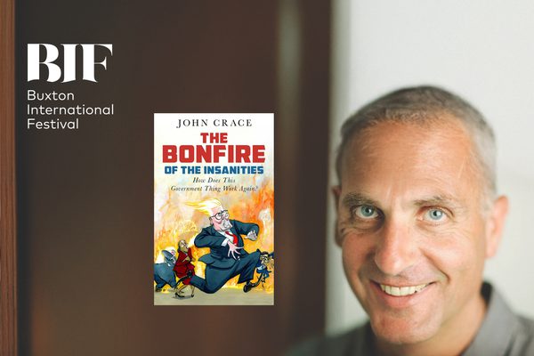 A man with short, grey hair and blue eyes is smiling at the camera, a book titled 'The Bonfire of the Insanities' by John Crace lies at the centre.