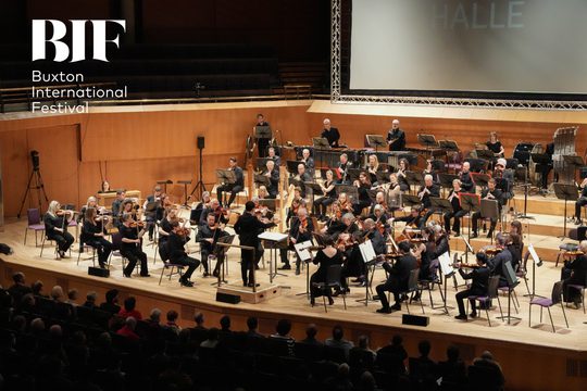 Large orchestra play for audience