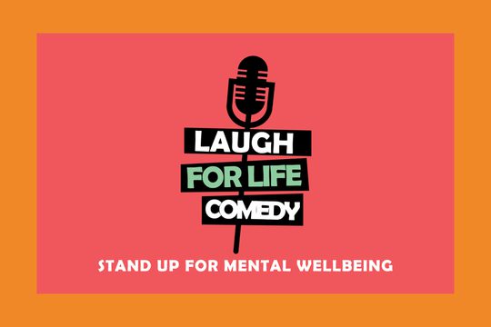 A red background with a black cartoon microphone. Text: Laugh for Life Comedy, Stand up for Mental Wellbeing.