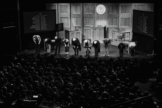 The cast taking a bow to an audience giving a standing ovation