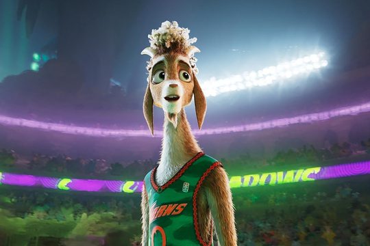 cartoon goat stands in the centre of a stadium wearing a green basketball shirt