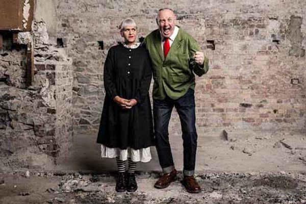 Keith and Marj standing in a stone room that is falling down.