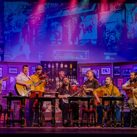 Musicians playing together in a pub.