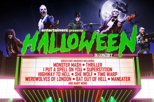 Various Halloween characters on top of an old cinema what's on board. Green text: Halloween in Concert.