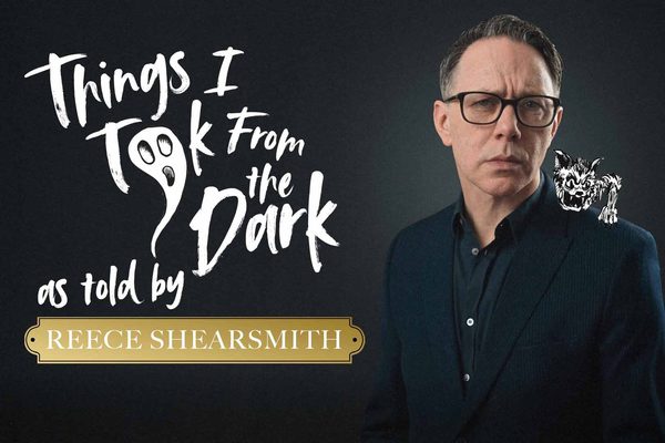 A man in a black suit against a black background wearing glasses. White text: Things I took From the Dark as told by Reece Shearsmith. Cartoon monsters are around him.