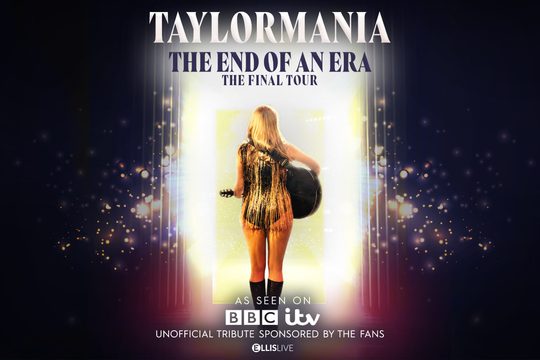 A woman in a gold sparkly dress with long blonde hair holding a guitar. We can see her back, and in front of her is a glow of light. Text: Taylormania, The End of an Era.