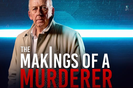 A man in a brown trench coat with blue police lights in the background.