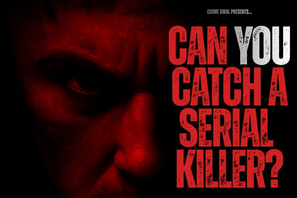 Close up of a man scowling just his eyes and nose visible. He is lit by a dim red light.