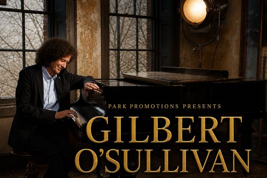 A man with curly hair wearing a black jacket sits at a grand piano. Gold text: Gilbert O'Sullivan, celebrating 60 years of music.