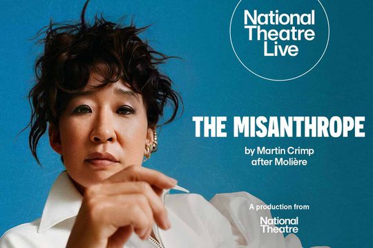 A woman with very dark curly hair wearing a white shirt. She is against a teal background. White text: The Misanthrope.