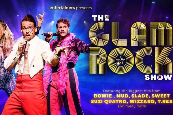 Three singers wearing elaborate outfits against a blue background. Yellow text: The Glam Rock Show.