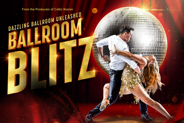 A man in a white shirt dances with a woman in a gold sparkly dress. They are in front of a disco ball on a red curtain.. Text: Ballroom Blitz