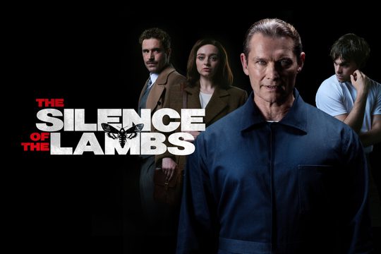 A dark background with four figures: A menacing man in a dark blue boiler suit, a man in a brown jacket with a moustache, a woman in a brown tweed jacket, and a man in a white t-shirt. Text: The Silence of the Lambs.