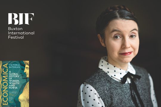White woman with dark hair and red lipstick smiles to camera. Front cover of her book is visible title reads : A global history of women wealth and power.