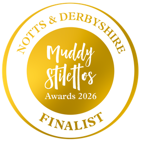 A gold circle with text that reads: Notts & Derbyshire Muddy Stilettos Awards 2026 Finalist
