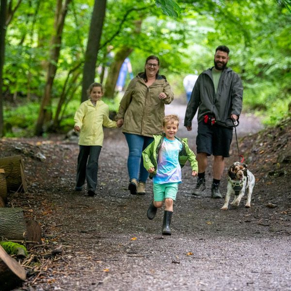 Family enjoying a dog walk in Grin Low woods